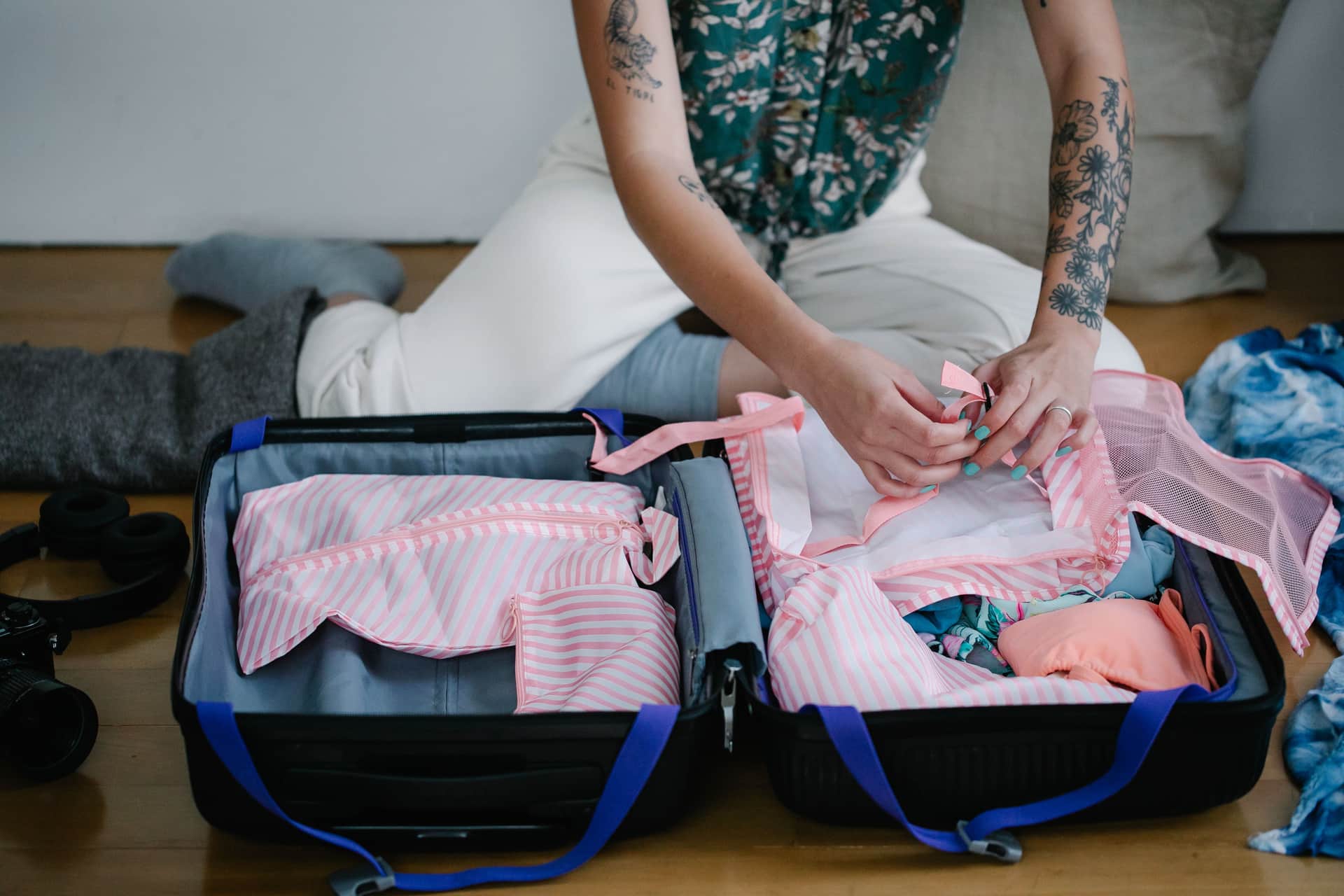 A bag being packed on the floor before a trip (illustrative photo)